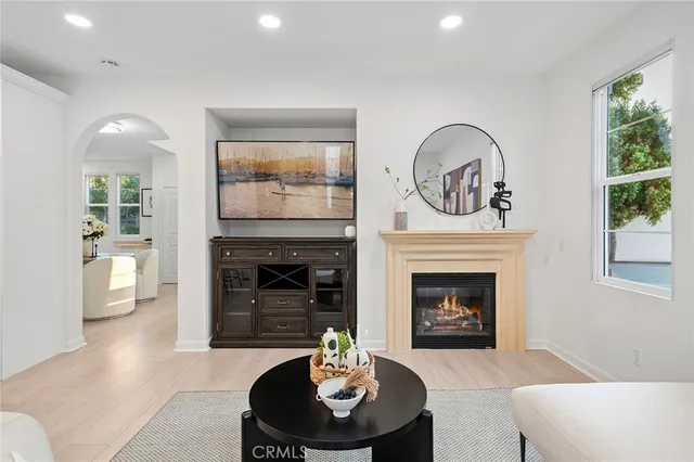 a dining room with furniture and a potted plant