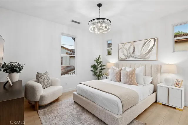 a bedroom with bed and window