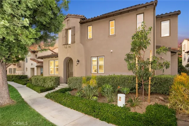 a view of a patio with table and chairs and potted plants