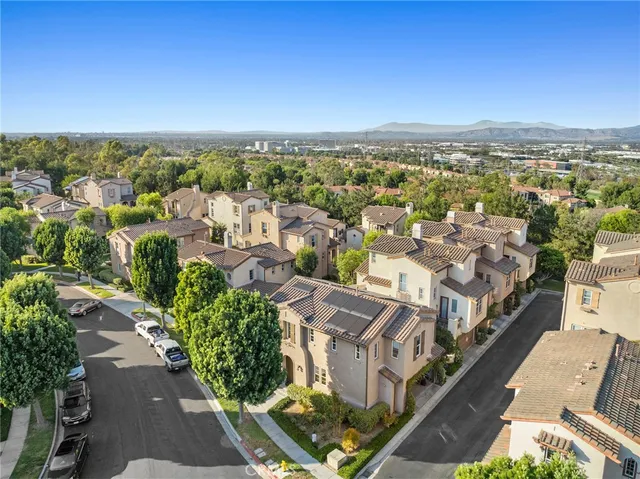 a view of a yard with a house in the background