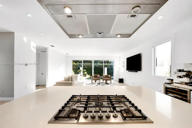 a bed room with a flat screen tv and a window