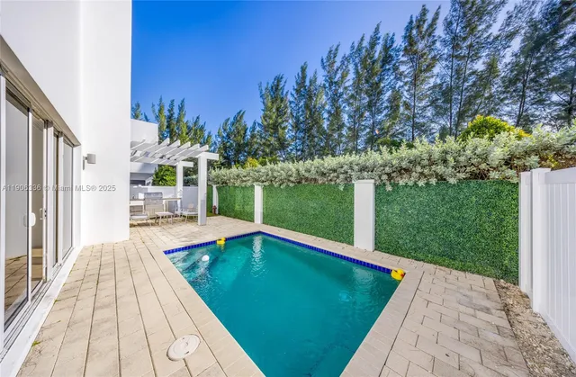 a view of a swimming pool with a patio