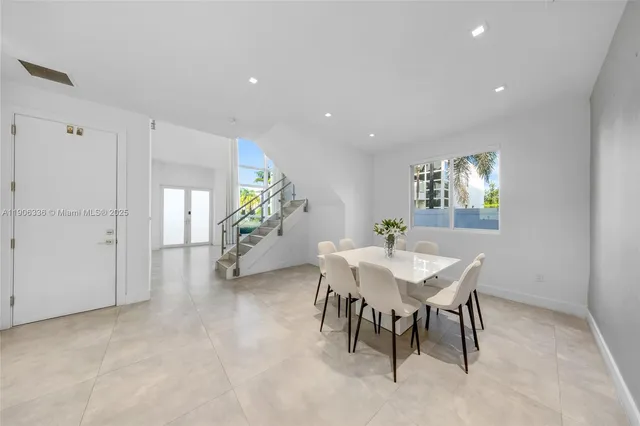a view of a livingroom with furniture and a potted plant