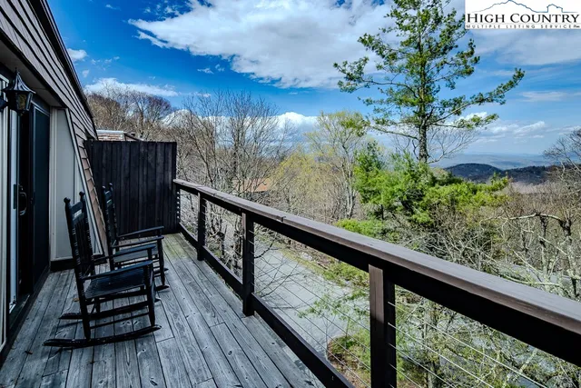 a view of balcony with wooden floor