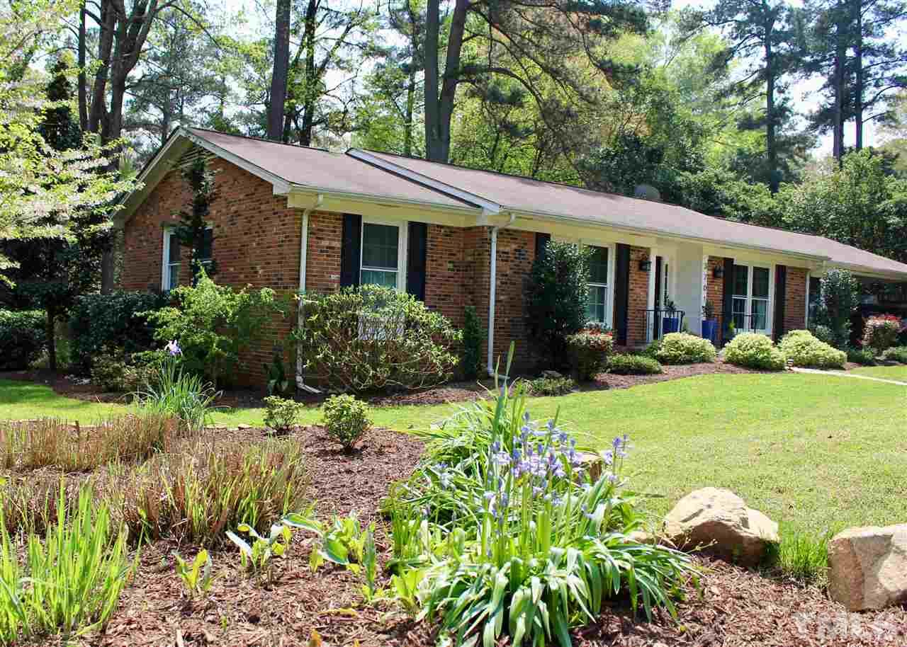 3701 Lail Court Raleigh, NC 27606 - Photo 1 of 25 a view of a house with garden and plants