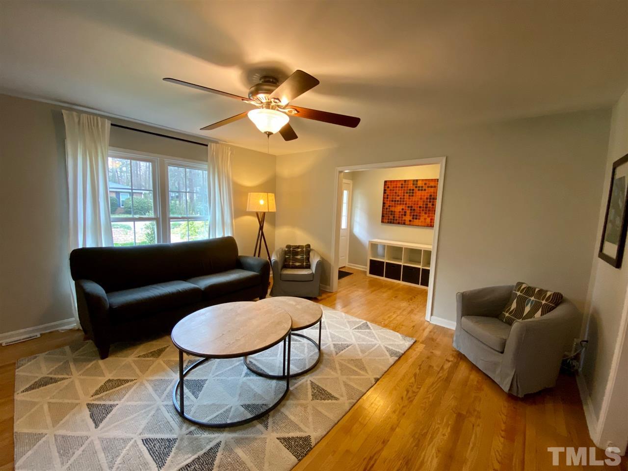 3701 Lail Court Raleigh, NC 27606 - Photo 2 of 25 a living room with furniture and wooden floor