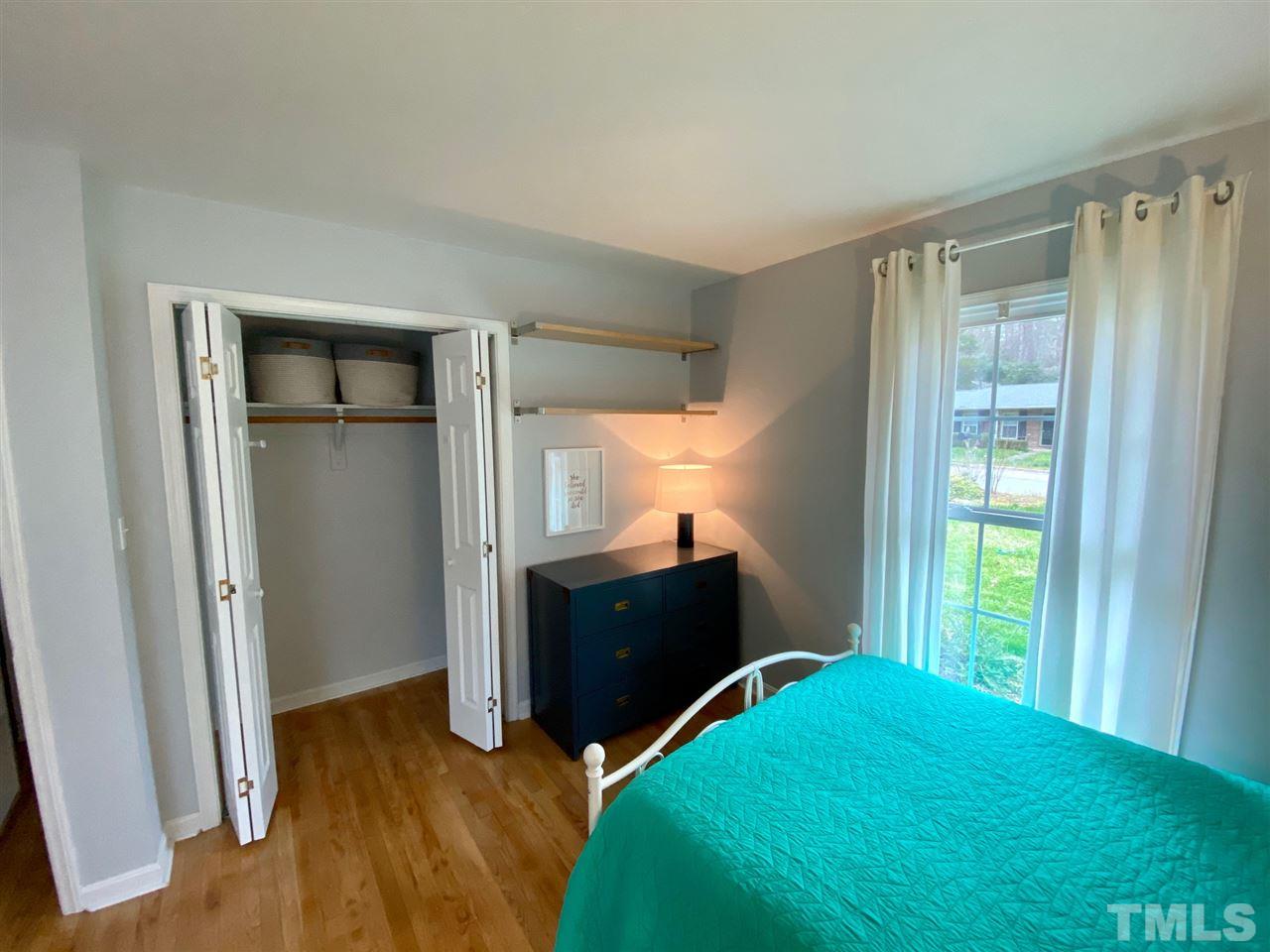 3701 Lail Court Raleigh, NC 27606 - Photo 11 of 25 a bedroom with a bed and a window