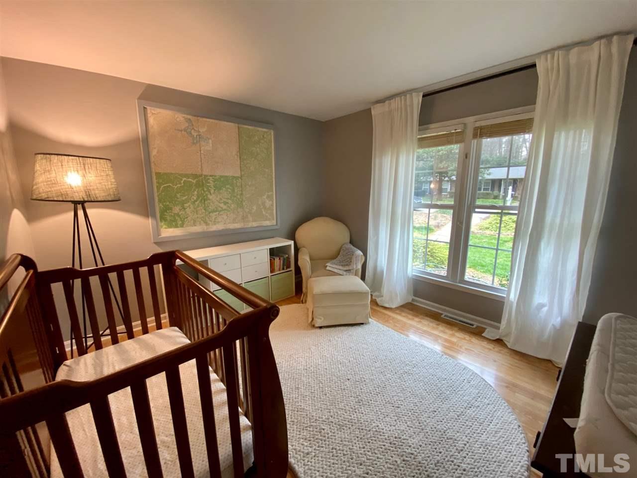 3701 Lail Court Raleigh, NC 27606 - Photo 14 of 25 a bedroom with furniture and a window