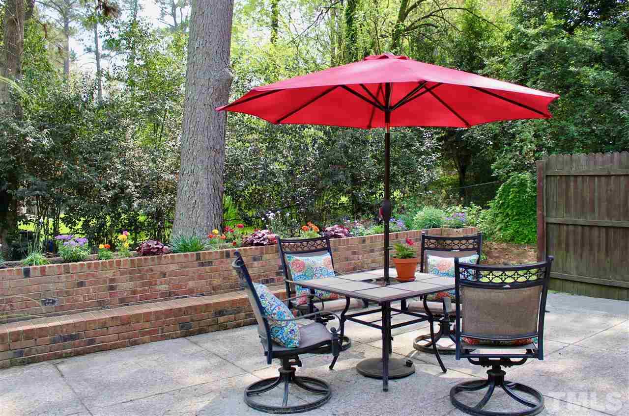 3701 Lail Court Raleigh, NC 27606 - Photo 17 of 25 a view of backyard with seating space and trees