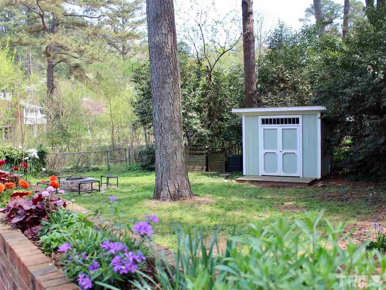 3701 Lail Court Raleigh, NC 27606 - Photo 19 of 25 a view of a house with a backyard and garden