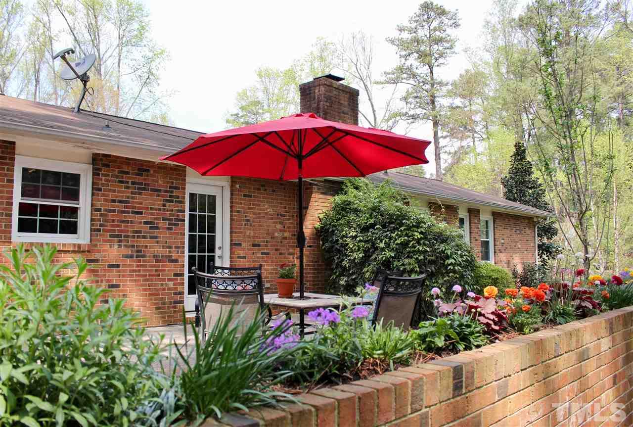3701 Lail Court Raleigh, NC 27606 - Photo 22 of 25 a view of a house with a yard and sitting area