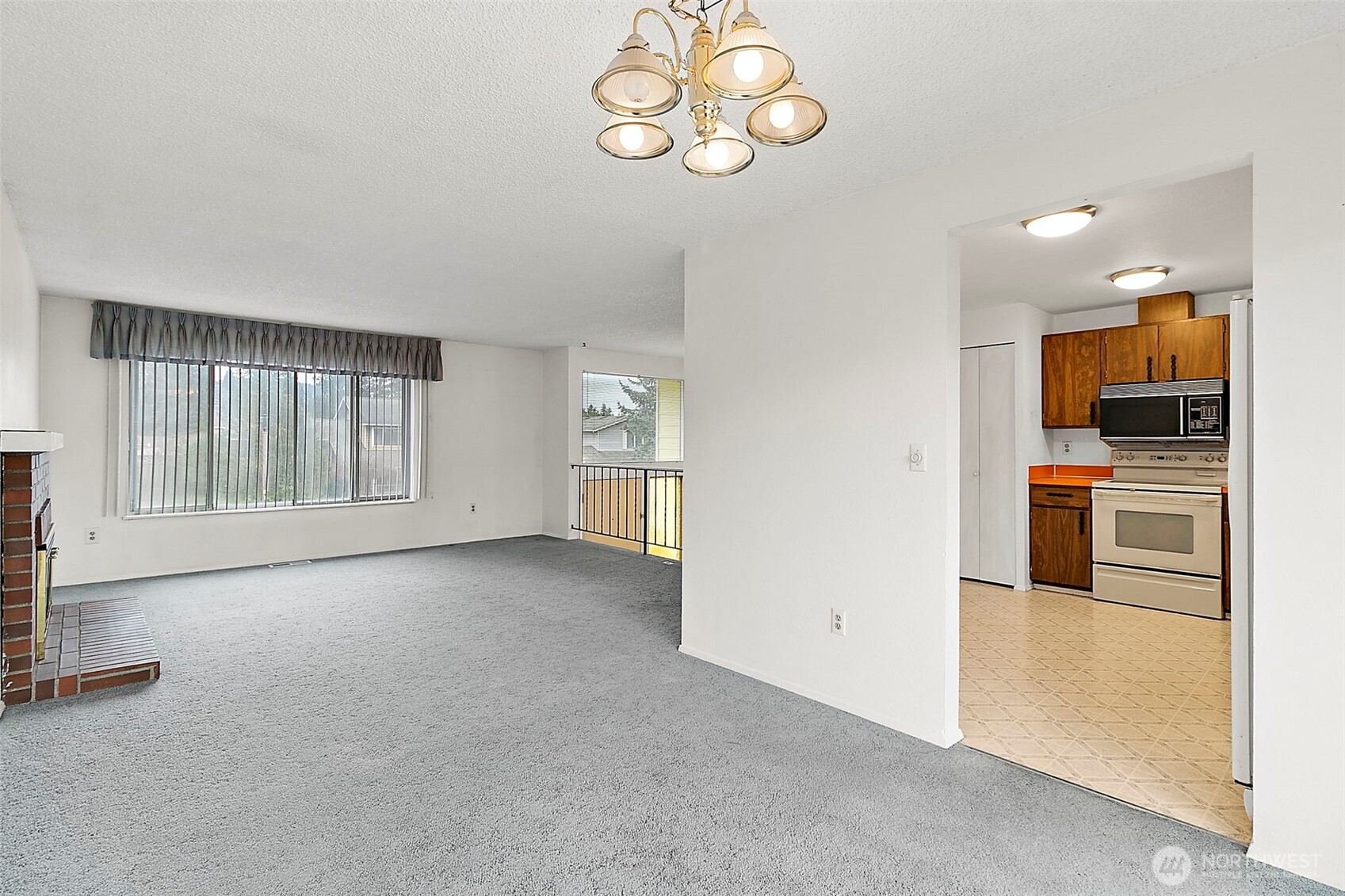 2115 Whitman Avenue Northeast Renton, WA 98059 - Photo 11 of 40 an empty room with a kitchen view and appliances