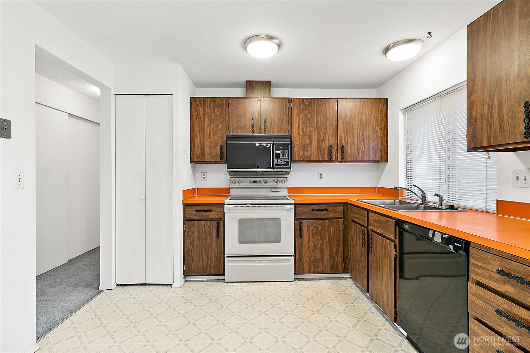 2115 Whitman Avenue Northeast Renton, WA 98059 - Photo 12 of 40 a kitchen with stainless steel appliances granite countertop a sink stove and refrigerator