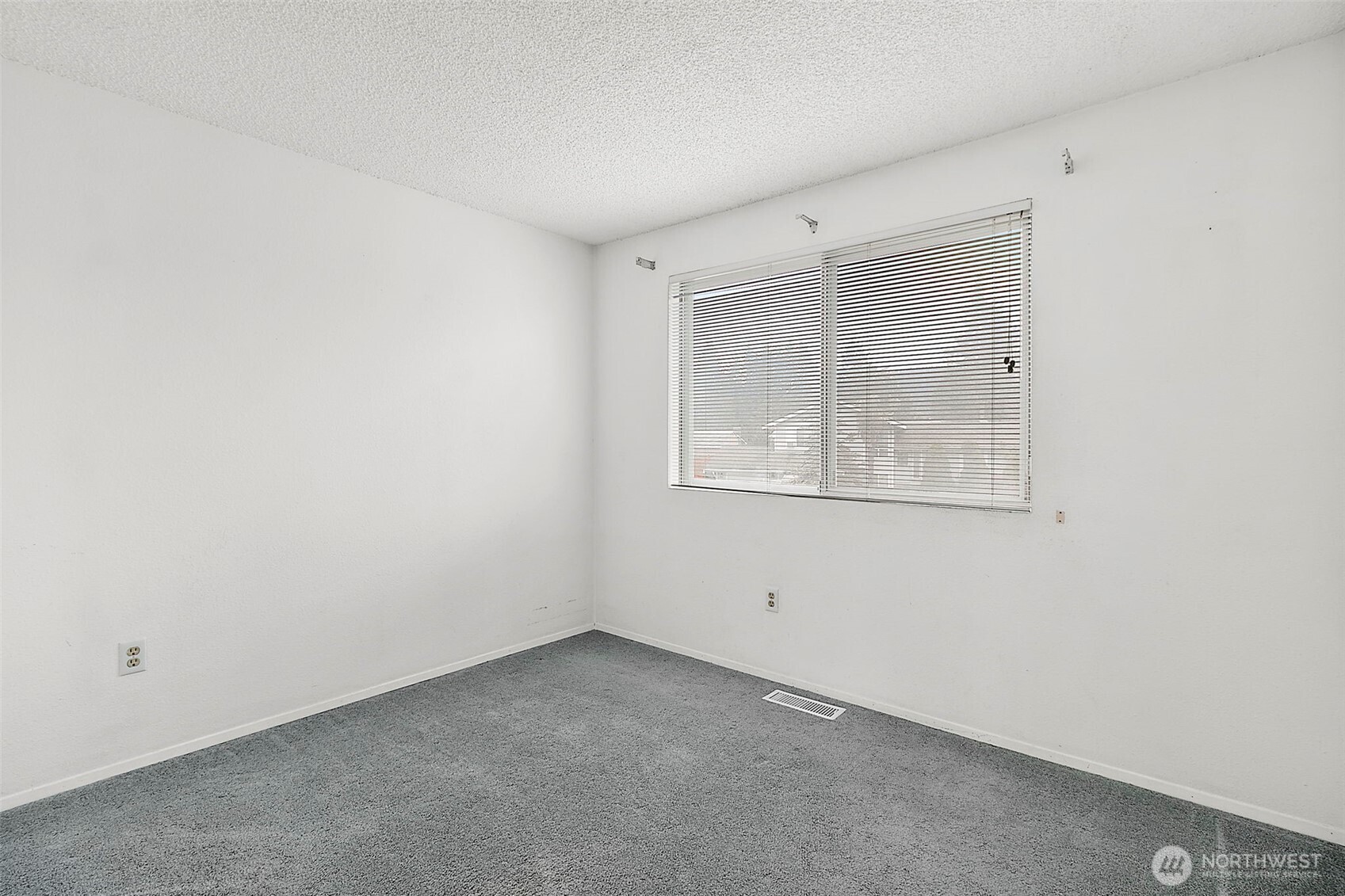 2115 Whitman Avenue Northeast Renton, WA 98059 - Photo 17 of 40 an empty room with a window