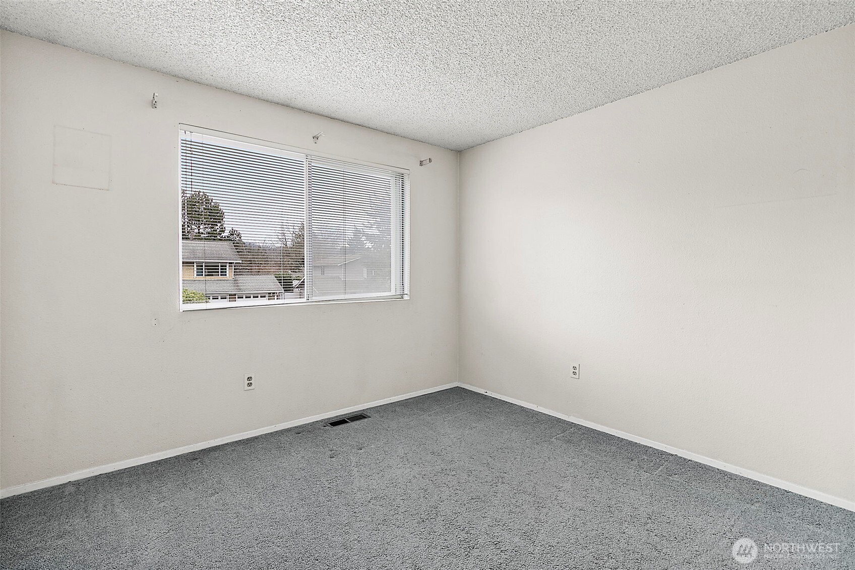 2115 Whitman Avenue Northeast Renton, WA 98059 - Photo 18 of 40 an empty room with a window