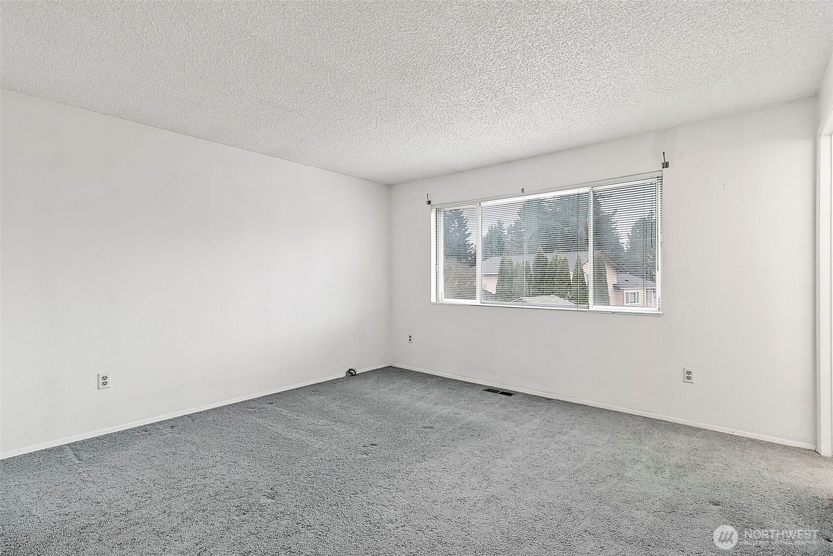 2115 Whitman Avenue Northeast Renton, WA 98059 - Photo 21 of 40 an empty room with windows