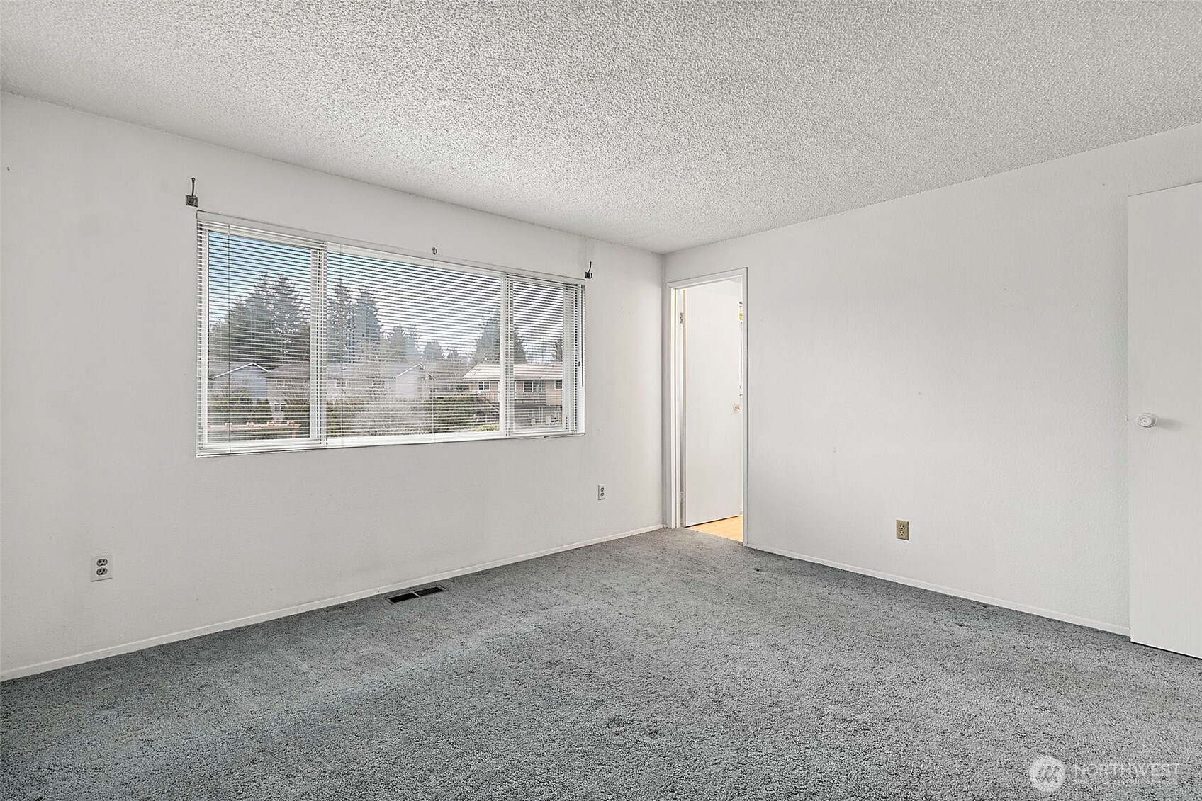 2115 Whitman Avenue Northeast Renton, WA 98059 - Photo 22 of 40 a view of an empty room with a window