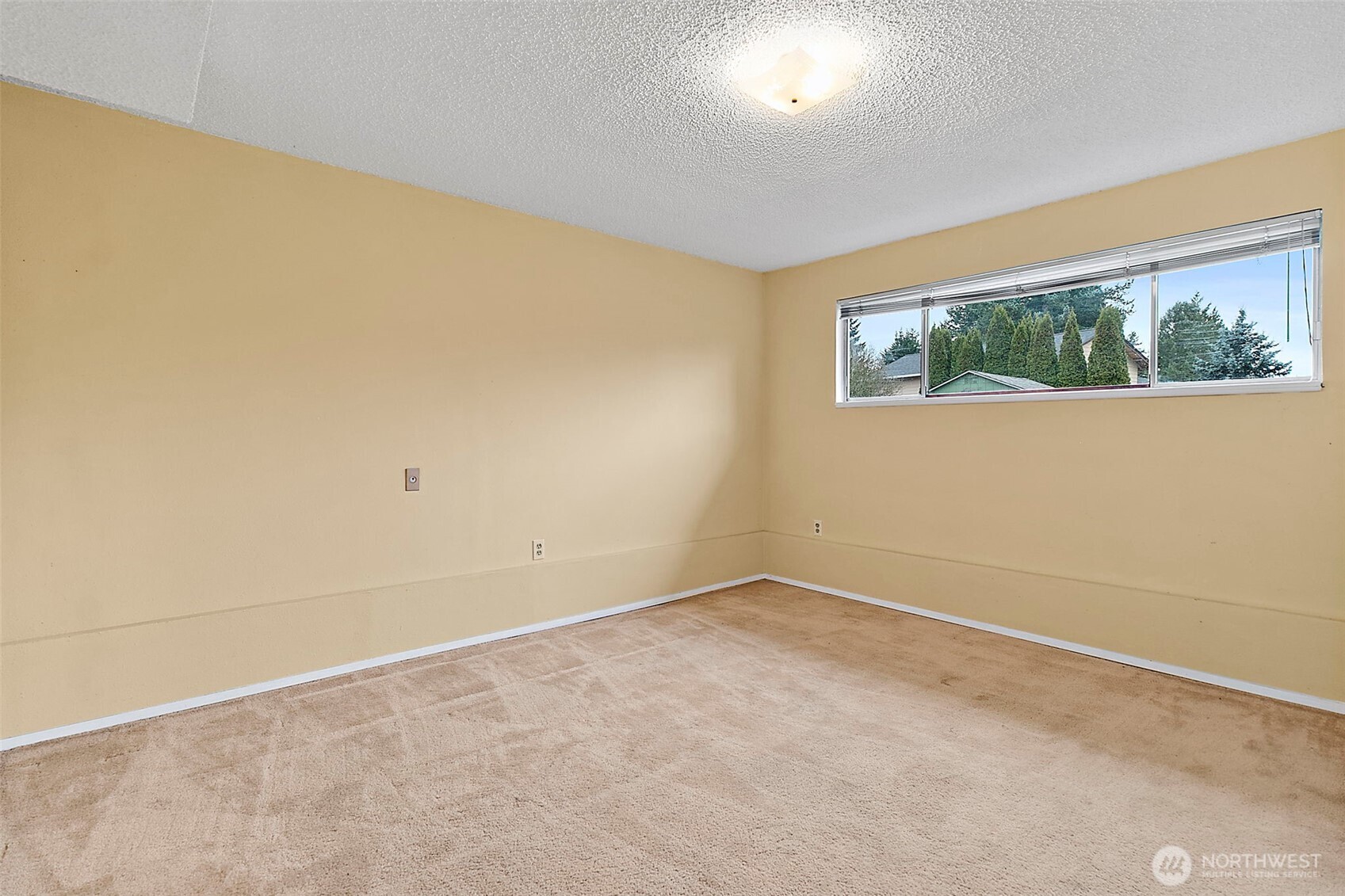 2115 Whitman Avenue Northeast Renton, WA 98059 - Photo 29 of 40 an empty room with a window