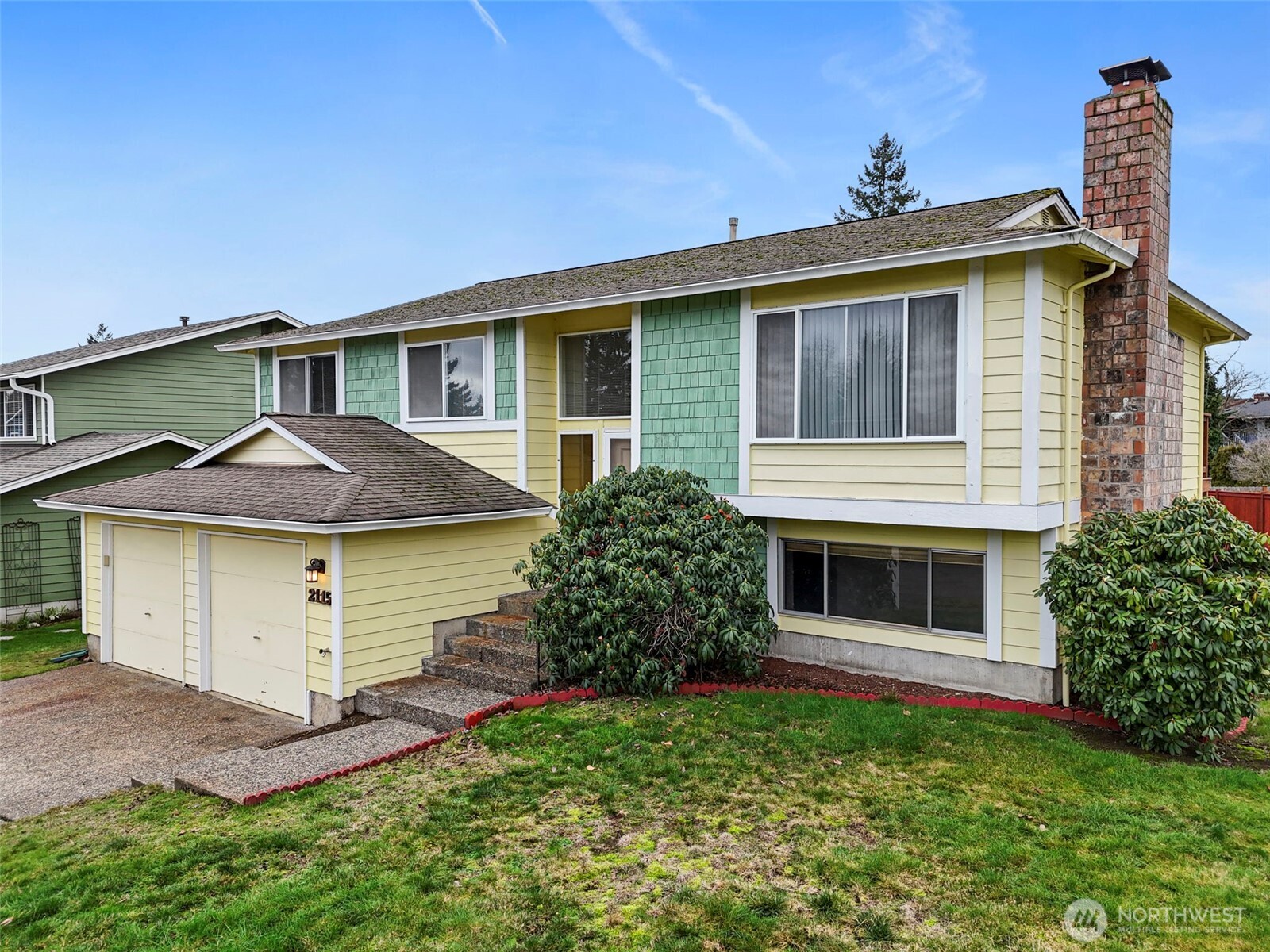 2115 Whitman Avenue Northeast Renton, WA 98059 - Photo 3 of 40 a view of a house with a yard and plants