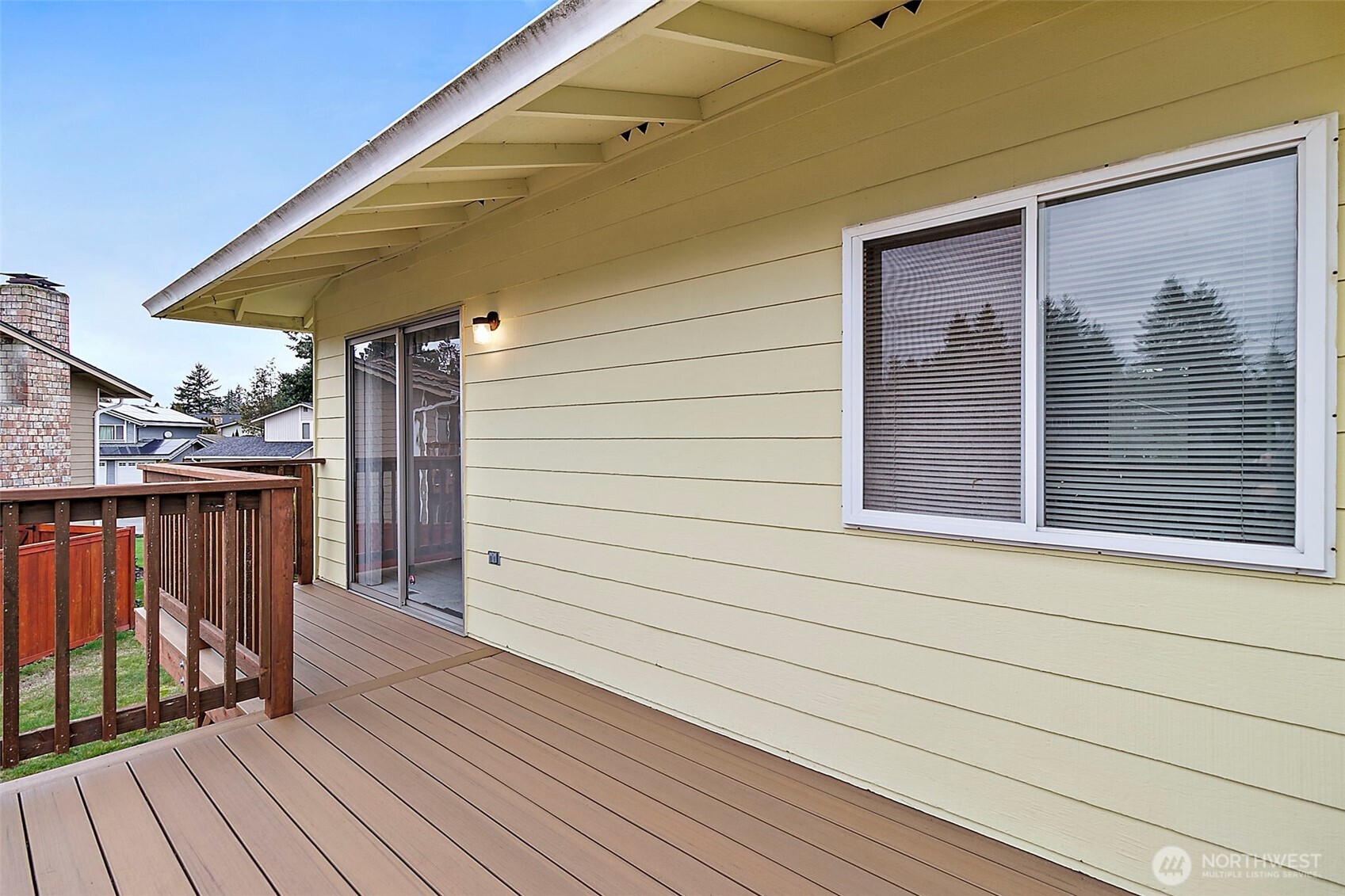 2115 Whitman Avenue Northeast Renton, WA 98059 - Photo 32 of 40 a view of a house with wooden deck