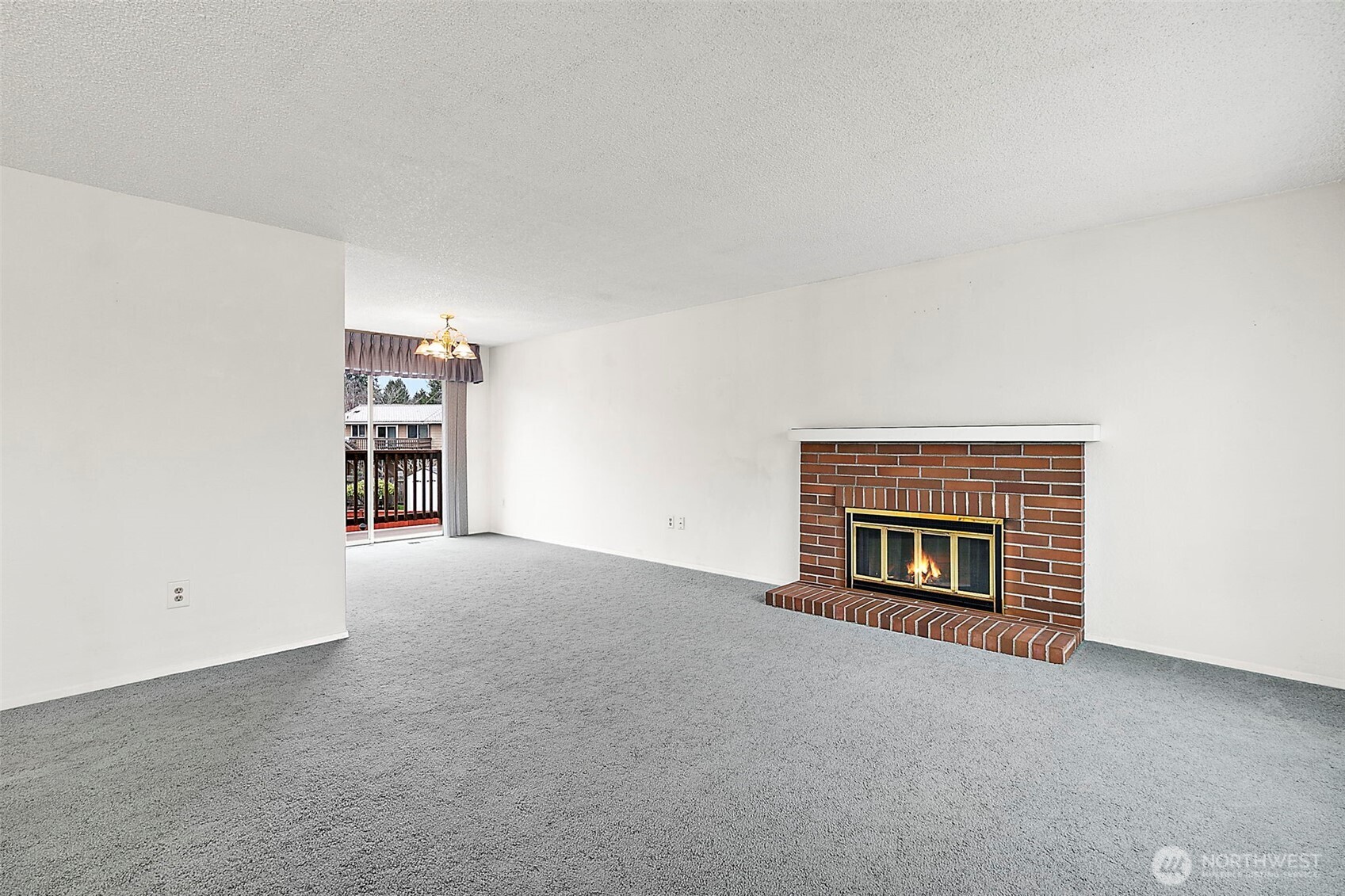2115 Whitman Avenue Northeast Renton, WA 98059 - Photo 6 of 40 a view of an empty room with a fireplace