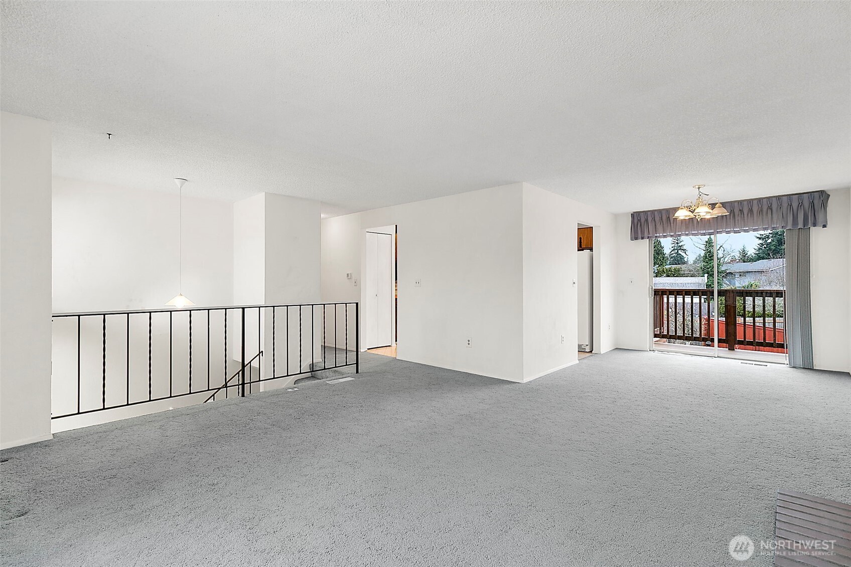 2115 Whitman Avenue Northeast Renton, WA 98059 - Photo 7 of 40 a view of an empty room with a balcony
