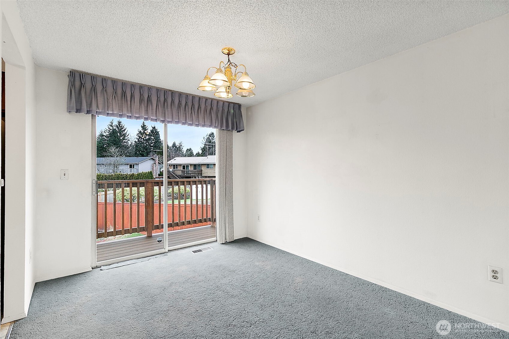 2115 Whitman Avenue Northeast Renton, WA 98059 - Photo 9 of 40 an empty room with windows