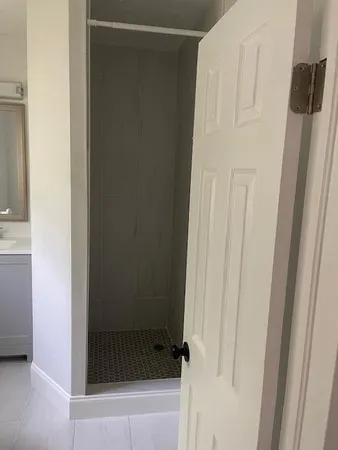 a bathroom with a glass door