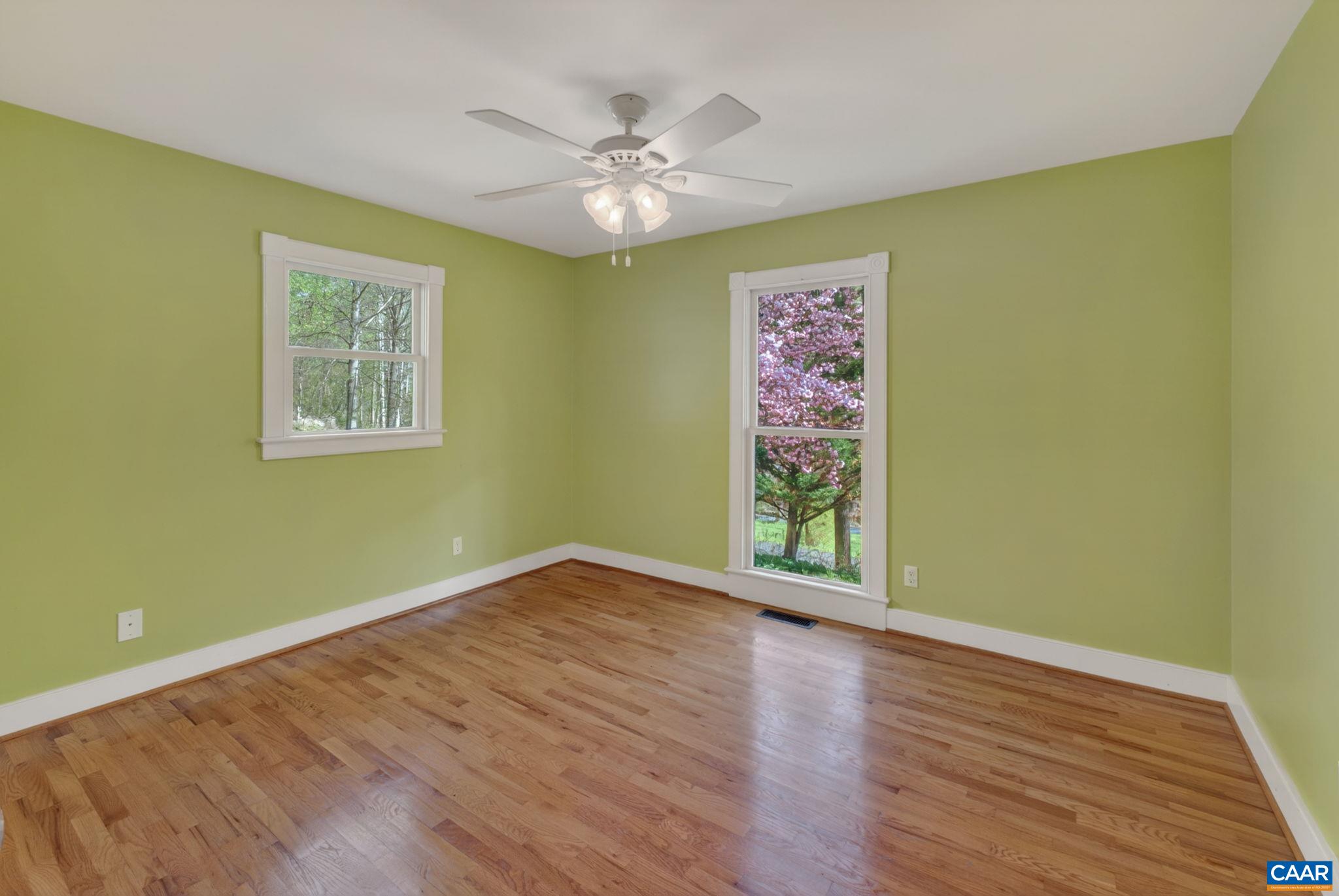 689 Mutton Hollow Road Stanardsville, VA 22973 - Photo 50 of 61 a view of an empty room with window and wooden floor