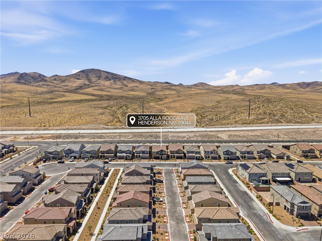 3705 Alla Rocca Avenue Henderson, NV 89044 - Photo 42 of 50 This elevated view captures a vibrant neighborhood set against a desert landscape.