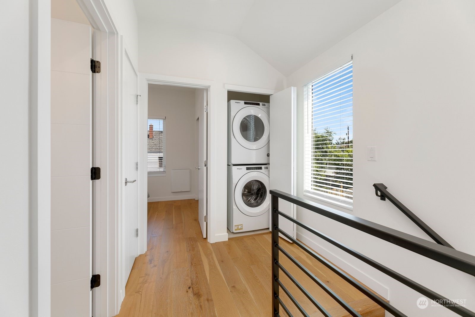4246 South Graham Street Seattle, WA 98118 - Photo 16 of 21 a view of a livingroom with wooden floor and white walls