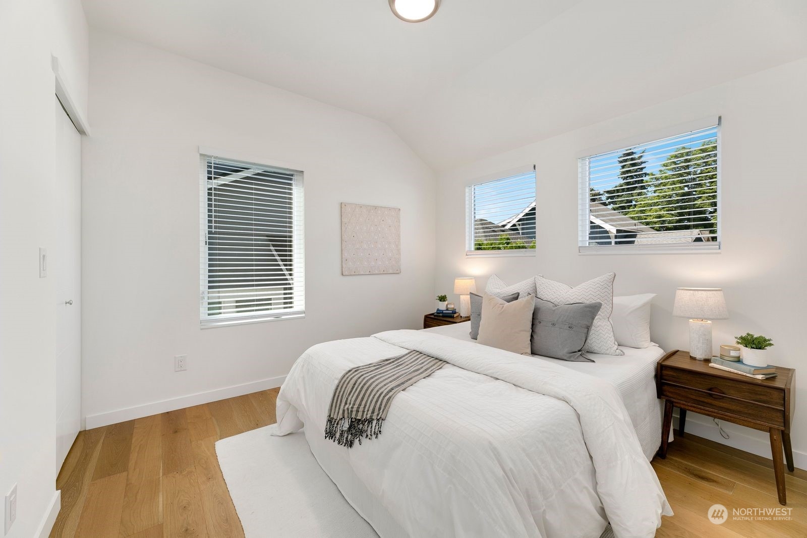 4246 South Graham Street Seattle, WA 98118 - Photo 17 of 21 a bedroom with a bed and a window