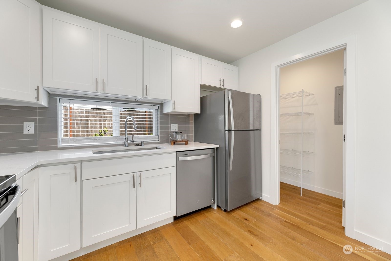 4246 South Graham Street Seattle, WA 98118 - Photo 8 of 21 a kitchen with a refrigerator and a sink