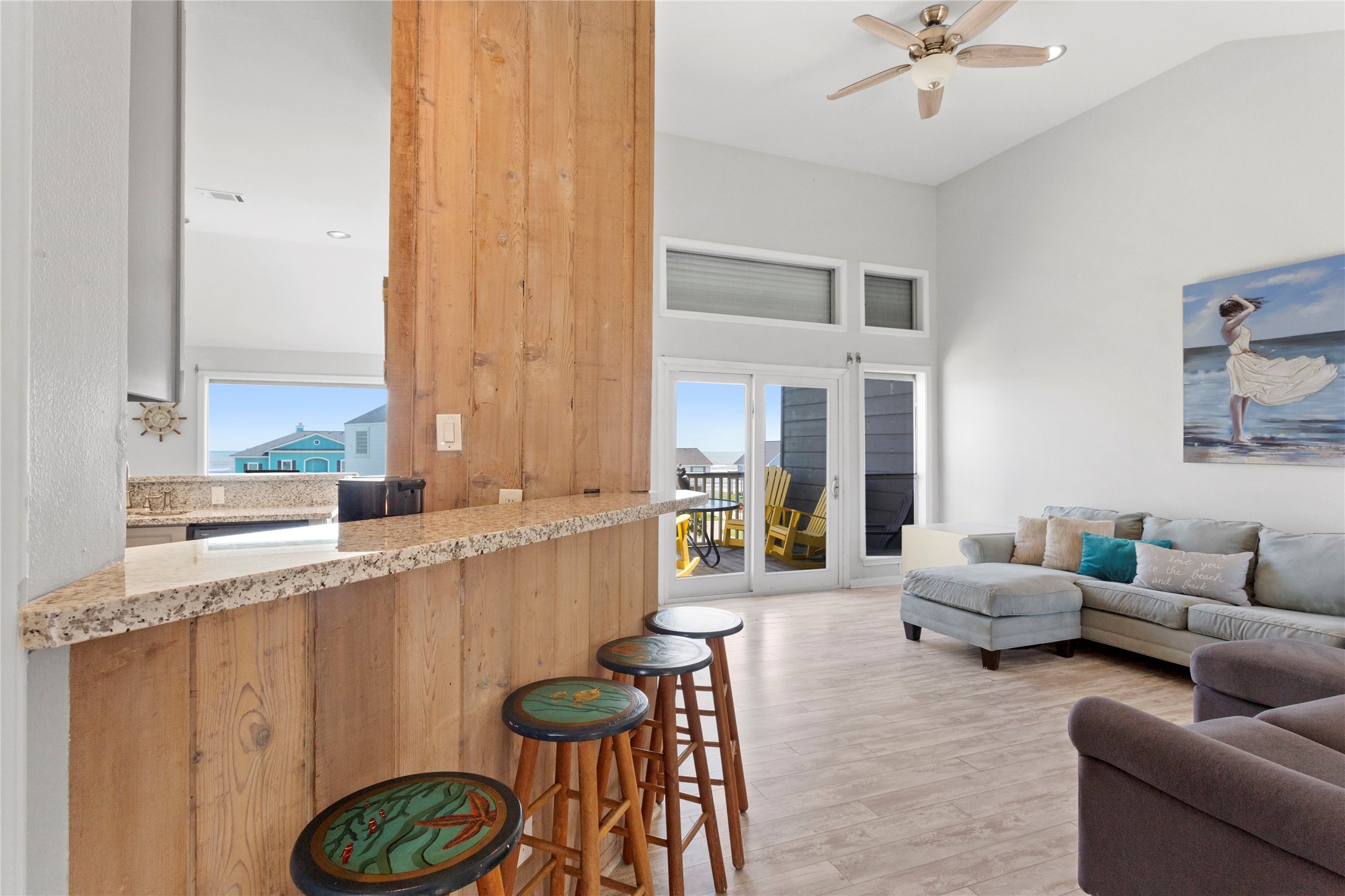 17627 Termini-San Luis Pass Road Galveston, TX 77554 - Photo 3 of 28 Cozy bar area opens to roomy living space with wall of windows and vaulted ceilings.