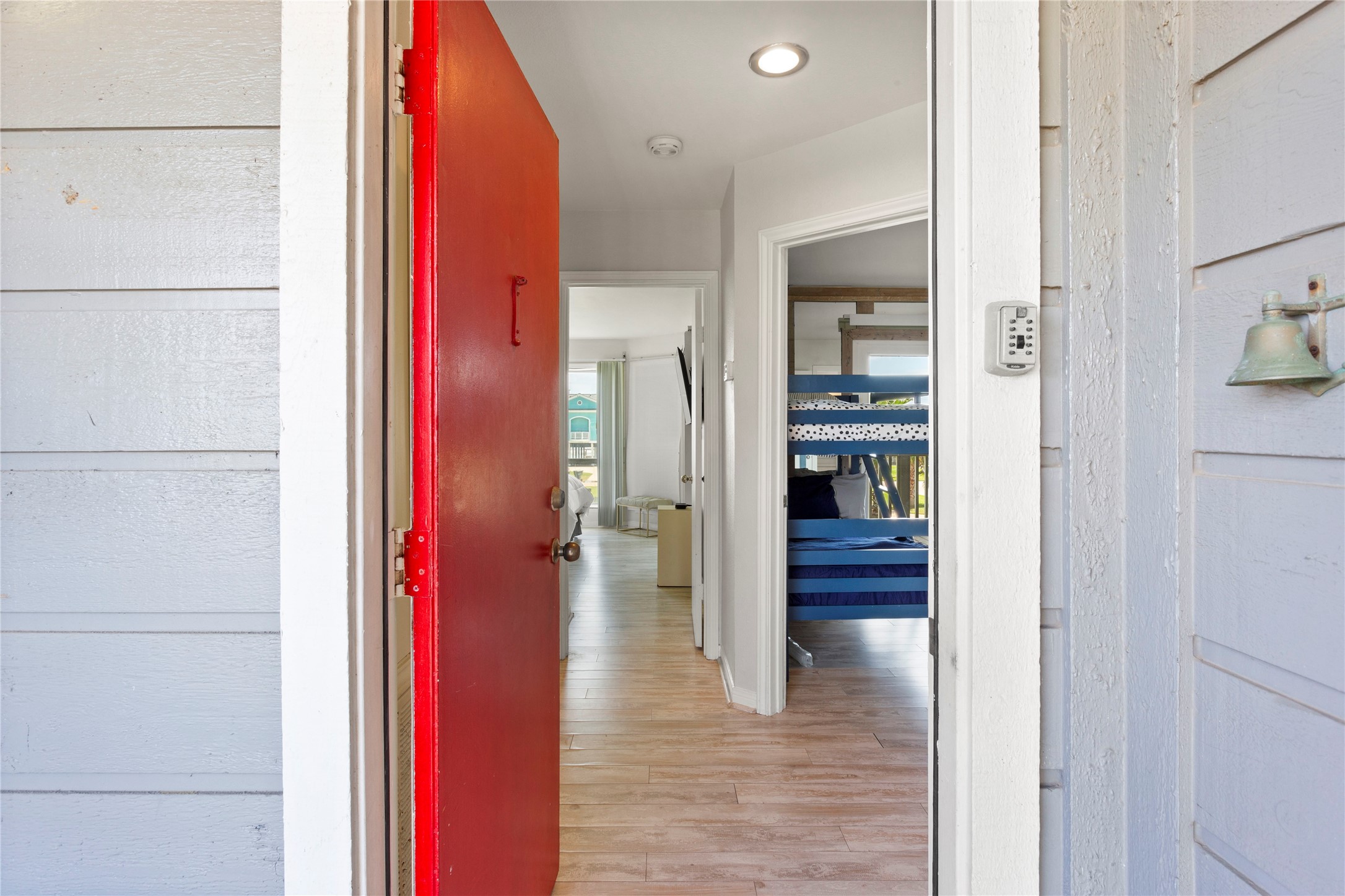 17627 Termini-San Luis Pass Road Galveston, TX 77554 - Photo 10 of 28 Step into warmth and charm with this striking red door, welcoming you home.