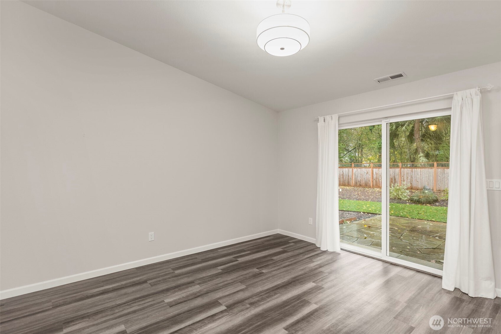 174 East Island View Avenue Port Townsend, WA 98368 - Photo 16 of 39 a view of a room with wooden floor and windows