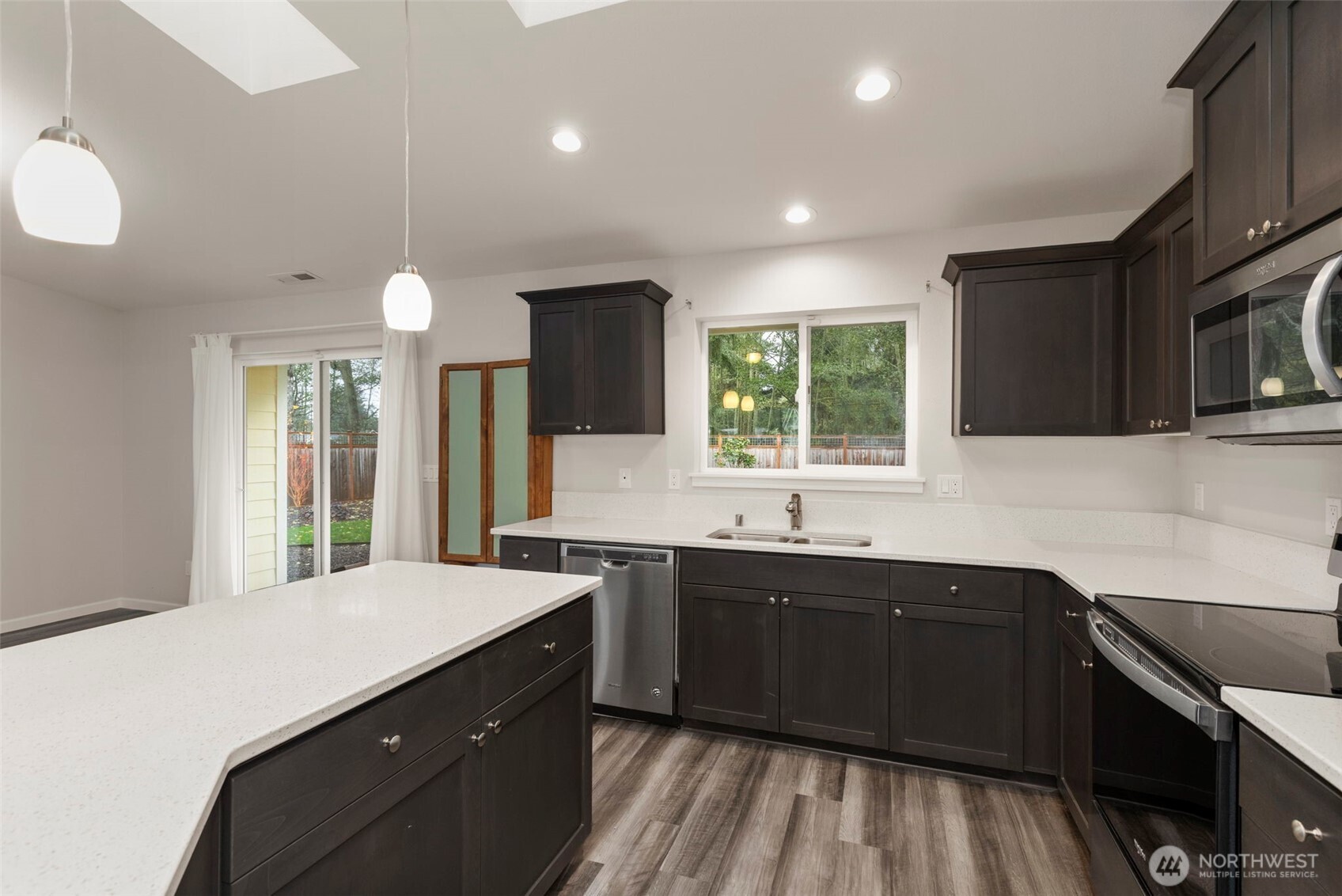 174 East Island View Avenue Port Townsend, WA 98368 - Photo 19 of 39 a kitchen with a sink stove and microwave