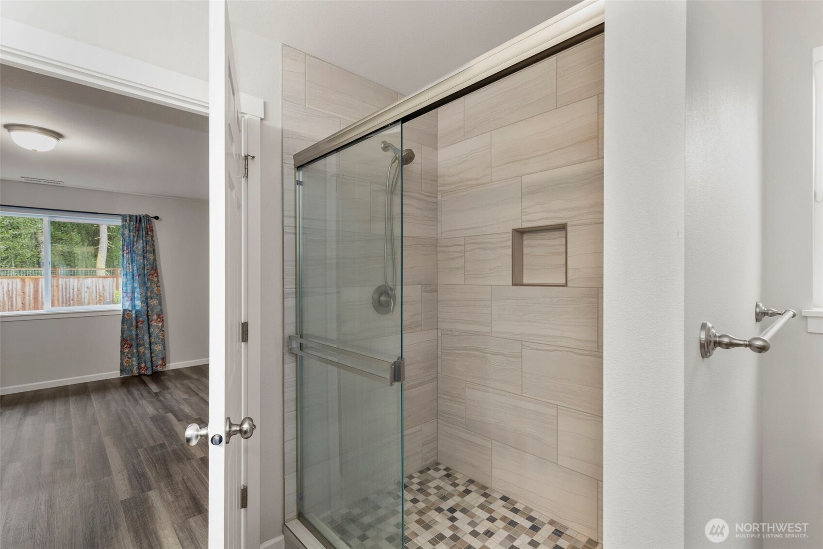 174 East Island View Avenue Port Townsend, WA 98368 - Photo 25 of 39 a bathroom with a glass shower door