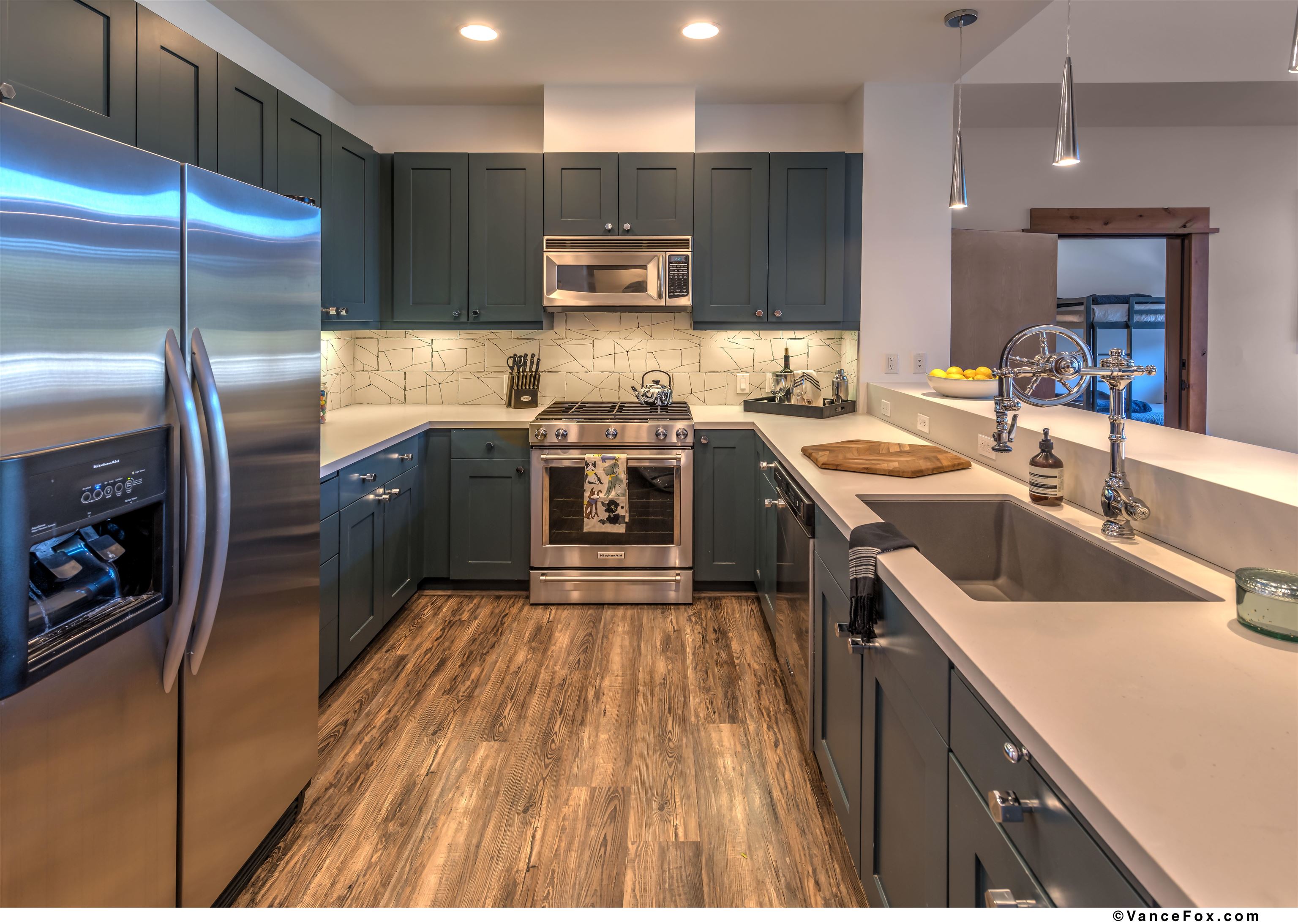 8001 Northstar Drive, Unit 403 Truckee, CA 96161 - Photo 4 of 10 a kitchen with stainless steel appliances granite countertop a sink a stove and a refrigerator