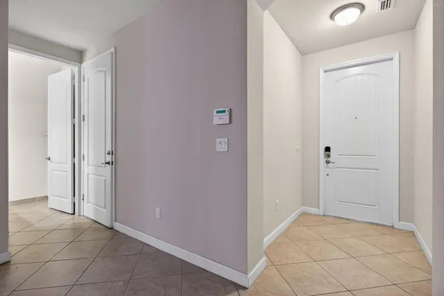 a bathroom with a sink a toilet and a light fixture
