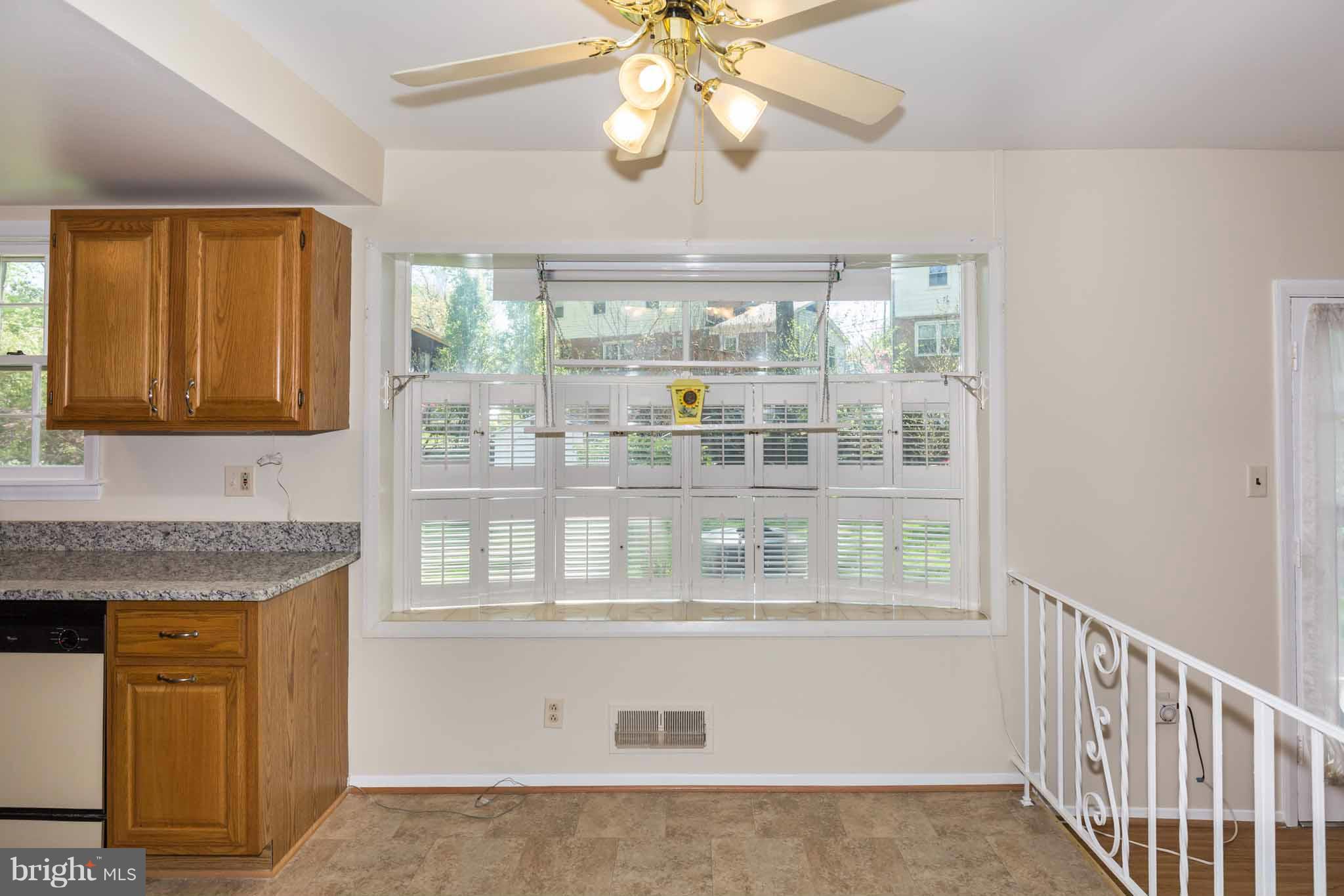 13405 Tamarack Road Silver Spring, MD 20904 - Photo 13 of 30 a kitchen with stainless steel appliances granite countertop a stove and a cabinet