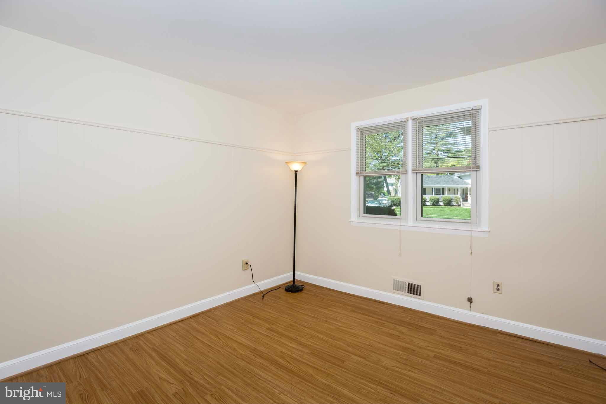 13405 Tamarack Road Silver Spring, MD 20904 - Photo 14 of 30 an empty room with wooden floor and windows