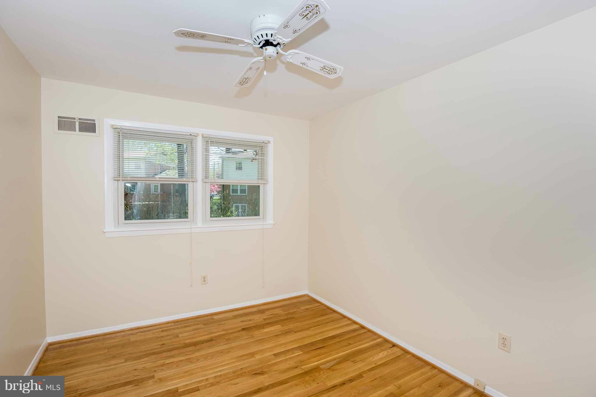 13405 Tamarack Road Silver Spring, MD 20904 - Photo 15 of 30 a view of empty room with wooden floor and fan