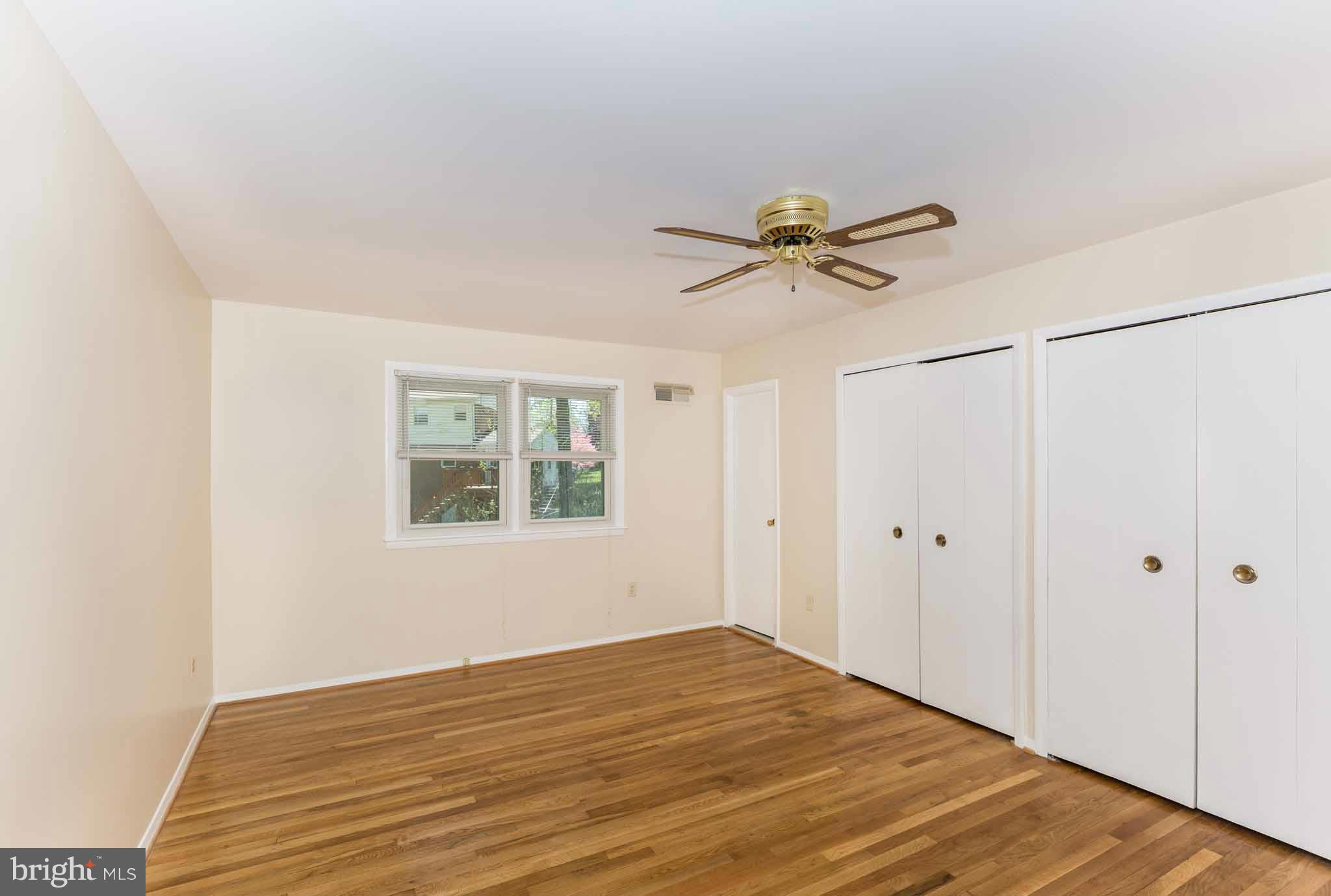 13405 Tamarack Road Silver Spring, MD 20904 - Photo 16 of 30 a view of a room with a ceiling fan and a window