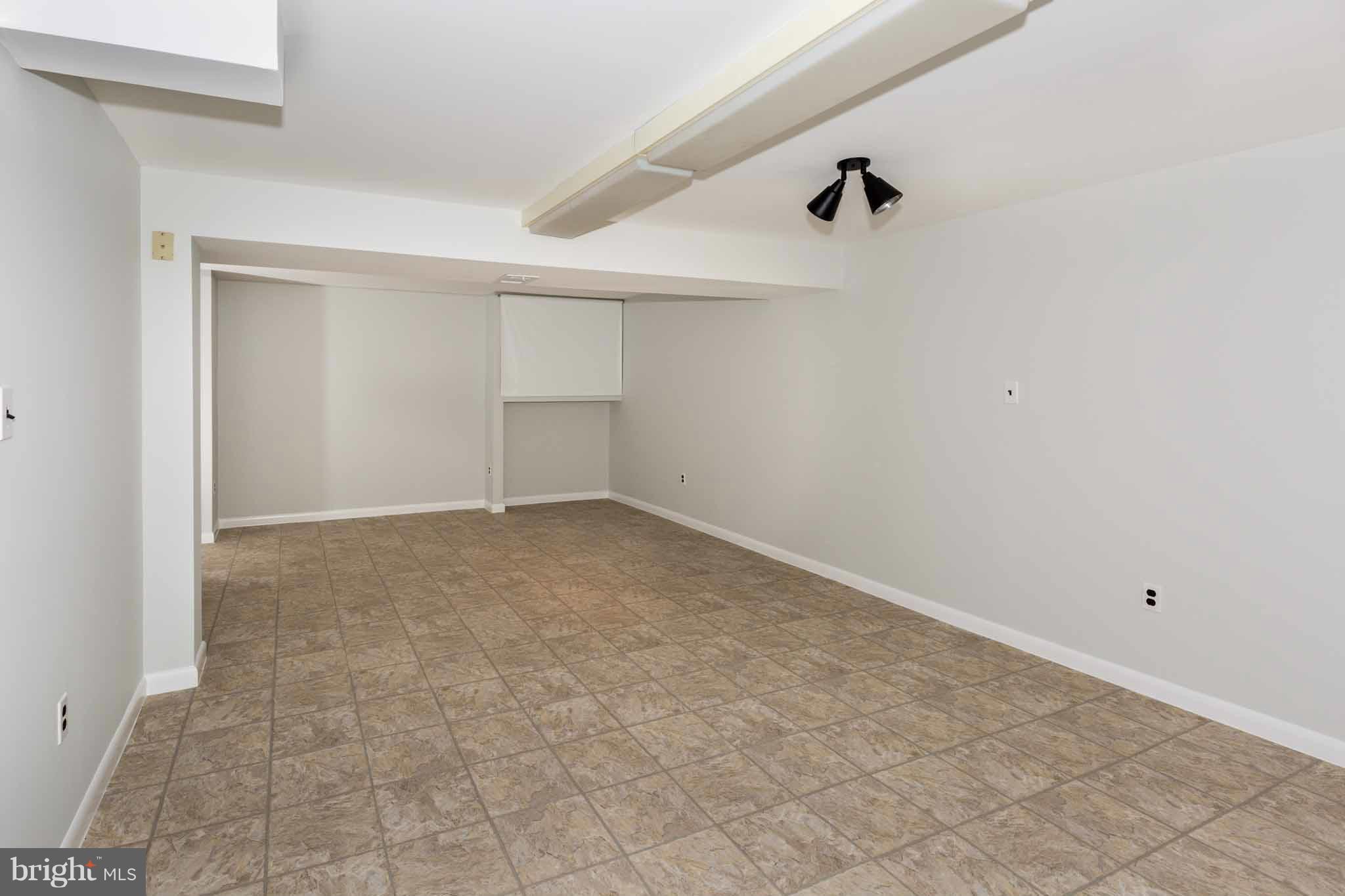 13405 Tamarack Road Silver Spring, MD 20904 - Photo 21 of 30 an empty room with shelves