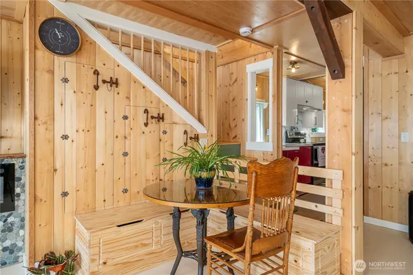 a view of entryway with wooden floor and front door