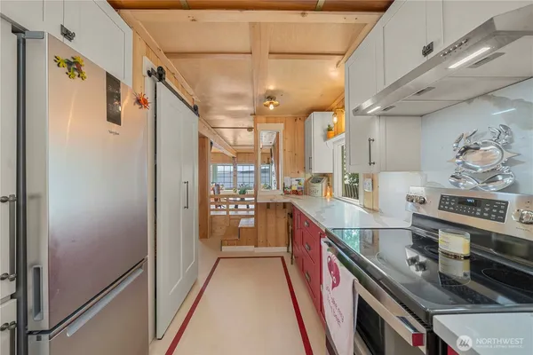 a kitchen with stainless steel appliances granite countertop a lot of counter space and a sink