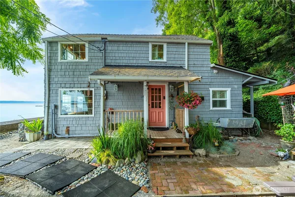 a front view of a house with garden