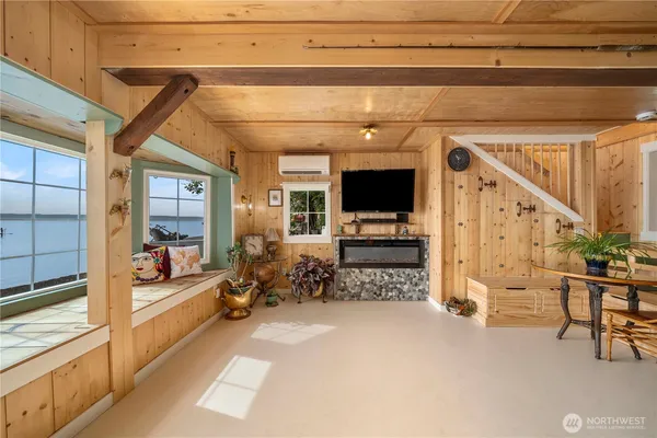 a view of living room kitchen and entryway