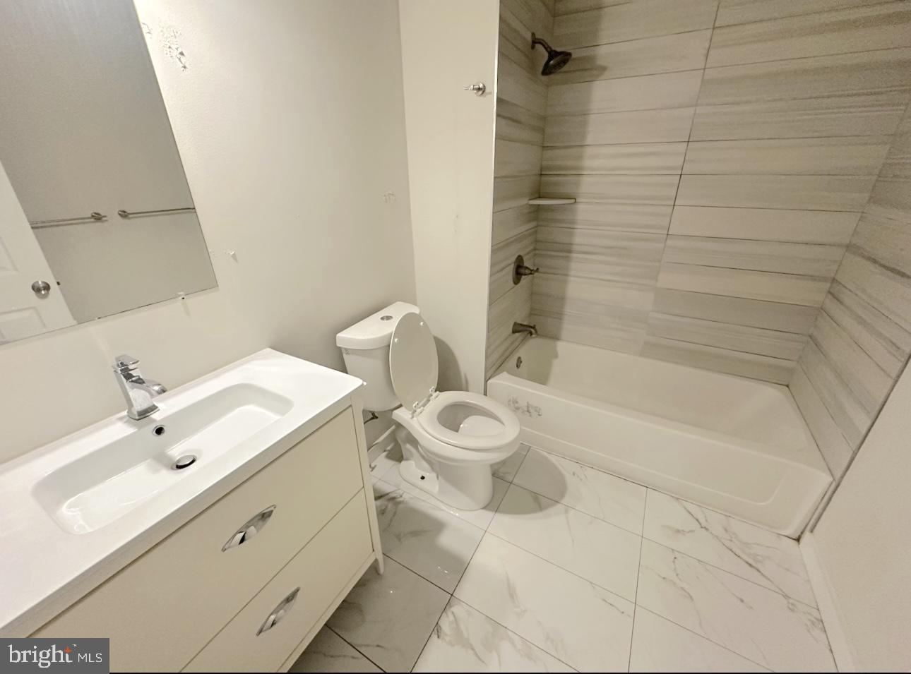 1324 North 17th Street, Unit 3 Philadelphia, PA 19121 - Photo 7 of 12 a bathroom with a sink a toilet and shower